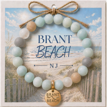 Load image into Gallery viewer, Carded Brant Beach Goldtone Beach Tag Amazonite Beaded Bracelet with twine bow