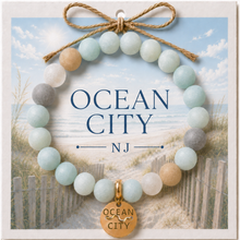 Load image into Gallery viewer, Carded Ocean City Goldtone Beach Tag Amazonite Beaded Bracelet with twine bow