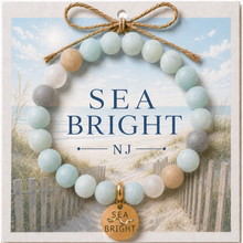 Load image into Gallery viewer, Carded Sea Bright Goldtone Beach Tag Amazonite Beaded Bracelet with twine bow
