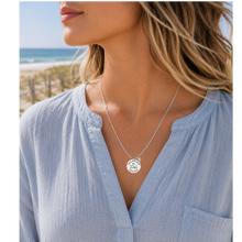 Load image into Gallery viewer, A woman at the beach wearing a necklace that has a starfish and beach badge pendant of Sea Bright, NJ