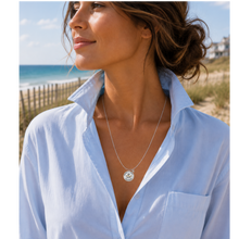 Load image into Gallery viewer, A woman at the beach wearing a necklace that has a starfish and beach badge pendant of Jersey Girl
