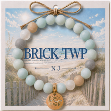 Load image into Gallery viewer, Carded Brick Twp Goldtone Beach Tag Amazonite Beaded Bracelet with twine bow
