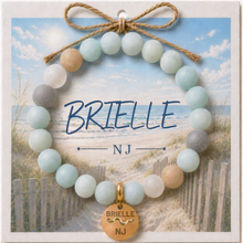 Load image into Gallery viewer, Carded Brielle NJ Goldtone Beach Tag Amazonite Beaded Bracelet with twine bow
