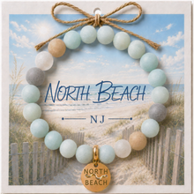Load image into Gallery viewer, Carded North Beach Goldtone Beach Tag Amazonite Beaded Bracelet with twine bow
