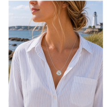 Load image into Gallery viewer, A woman at the beach wearing a necklace that has a starfish and beach badge pendant of North Beach, NJ
