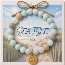 Load image into Gallery viewer, Carded Sea Isle Goldtone Beach Tag Amazonite Beaded Bracelet with twine bow
