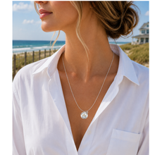 Load image into Gallery viewer, A woman at the beach wearing a necklace that has a starfish and beach badge pendant of Spring Lake, NJ
