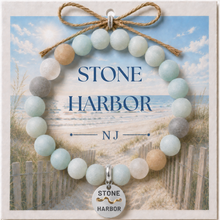 Load image into Gallery viewer, Carded Stone Harbor Silvertone Beach Tag Amazonite Beaded Bracelet with twine bow

