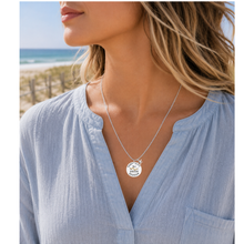 Load image into Gallery viewer, A woman at the beach wearing a necklace that has a starfish and beach badge pendant of Surf City, NJ
