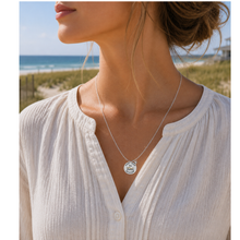 Load image into Gallery viewer, A woman at the beach wearing a necklace that has a starfish and beach badge pendant of Ventnor, NJ
