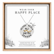 Load image into Gallery viewer, A carded Island Beach tag pendant on necklace with starfish in box
