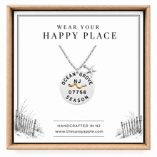 Load image into Gallery viewer, A carded Ocean Grove, NJ Beach tag pendant on necklace with starfish in box
