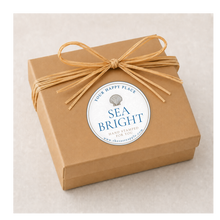 Load image into Gallery viewer, A kraft jewelry box with raffia ribbon for beach jewelry collection of Sea Bright, NJ
